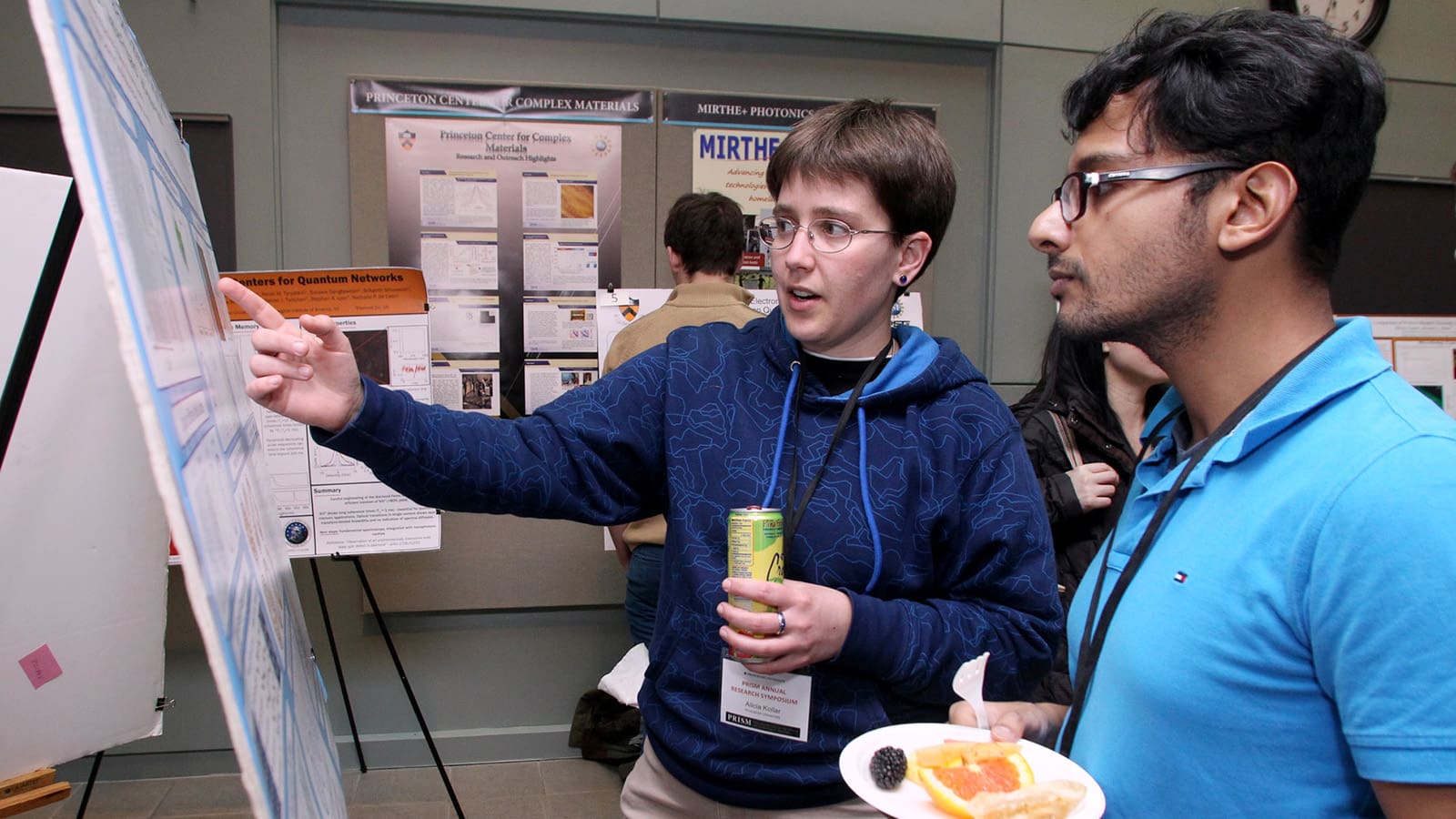 Researchers discuss recent work during "poster session"
