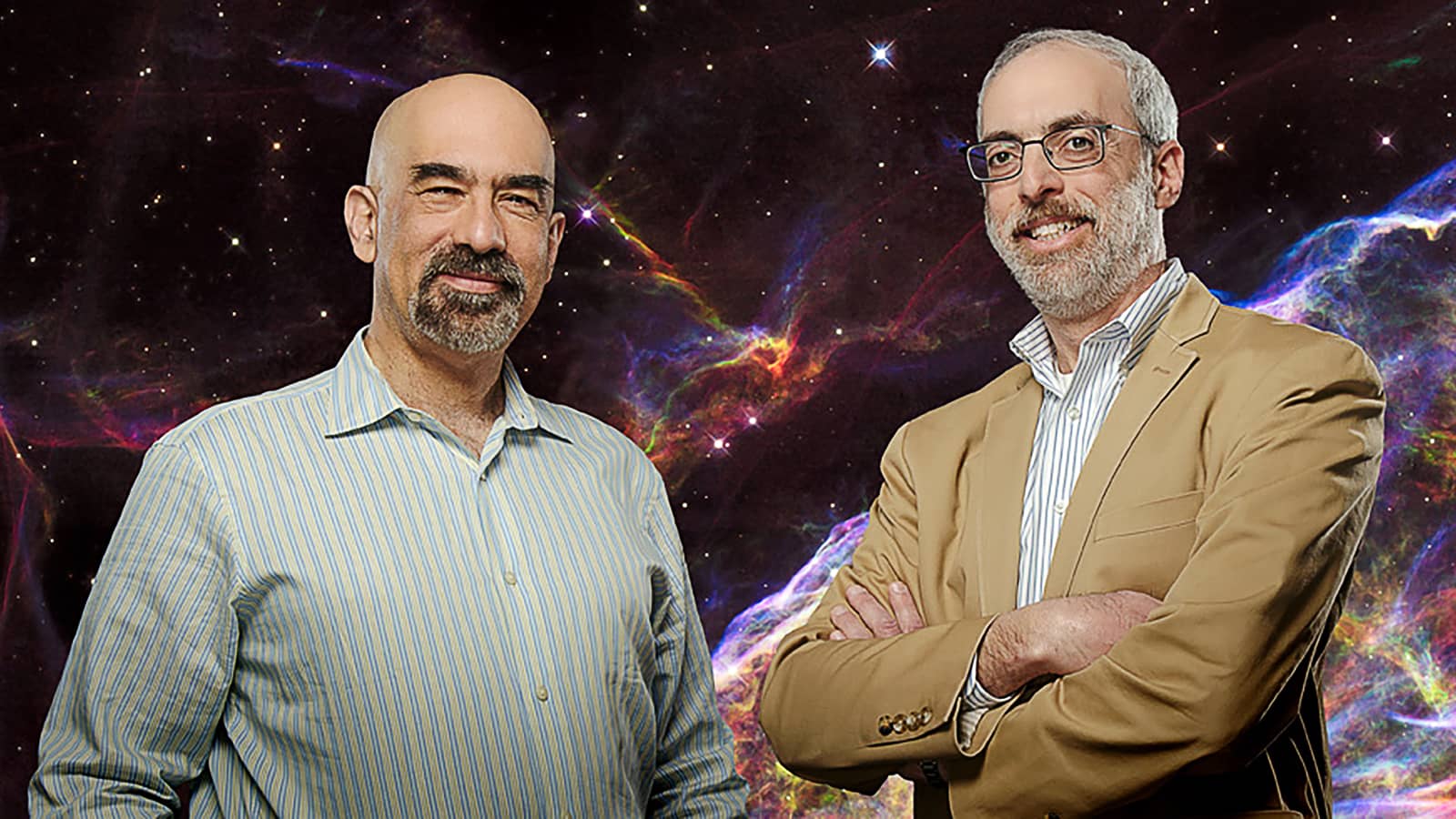 David Spergel and Jeremy Kasdin pose in front of colorful space image