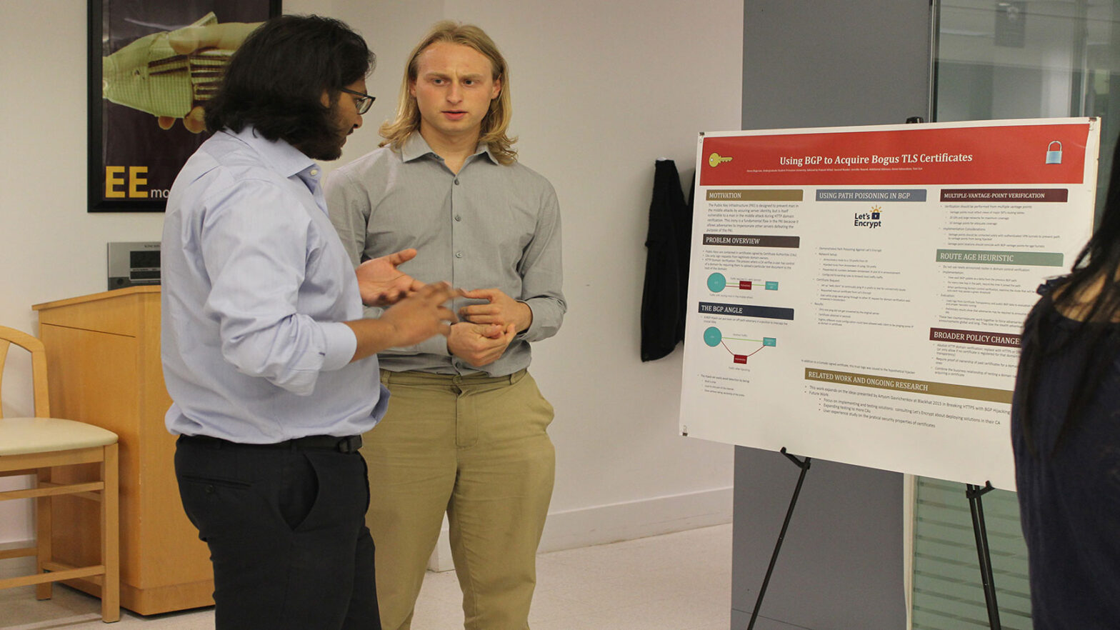 Research and student speak at poster presentation