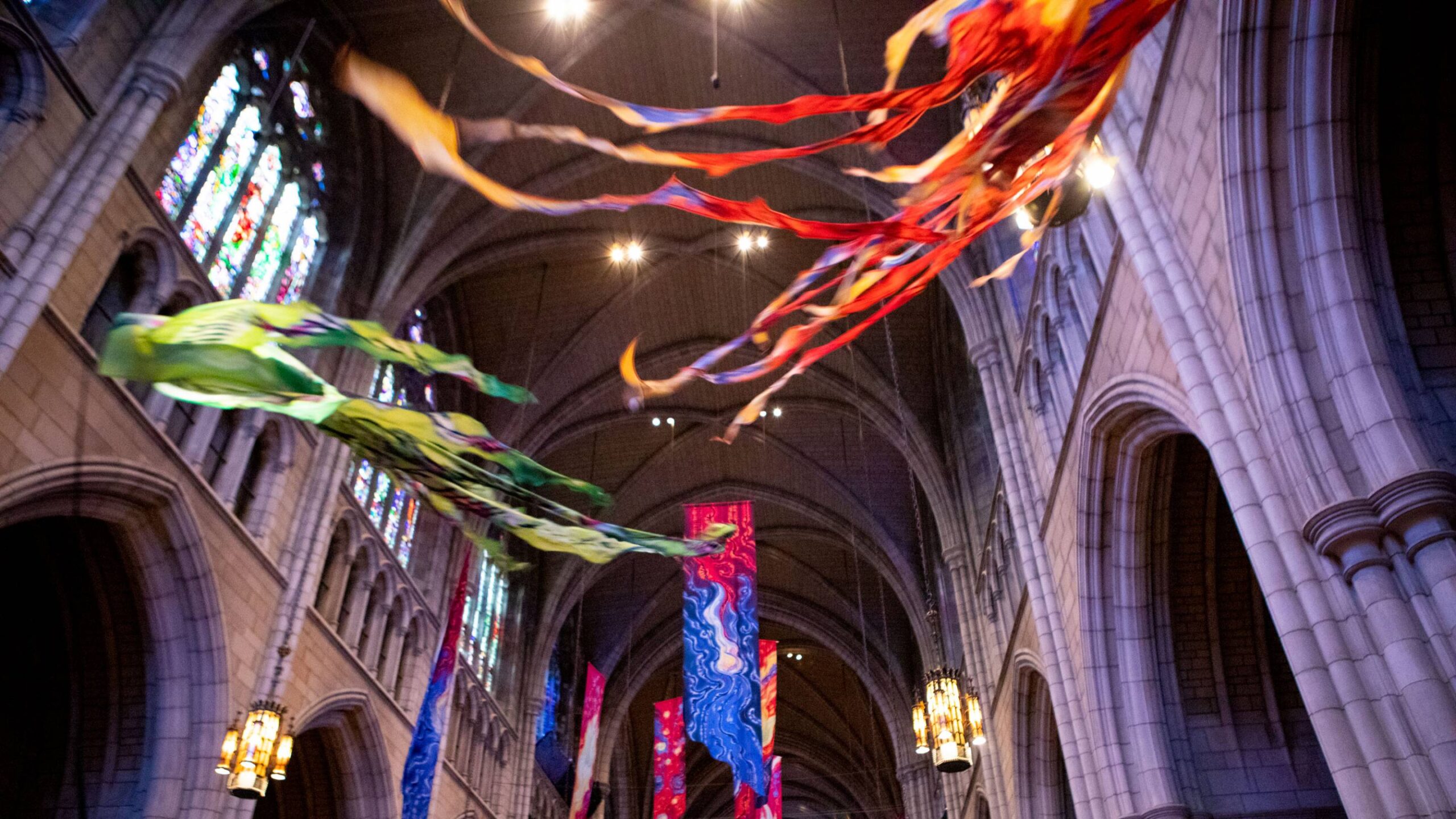 Chapel ceiling with flying colorful banners.