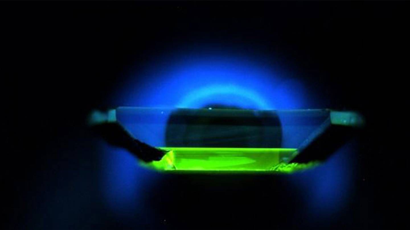 Neon blue and green image representing quantum computing.