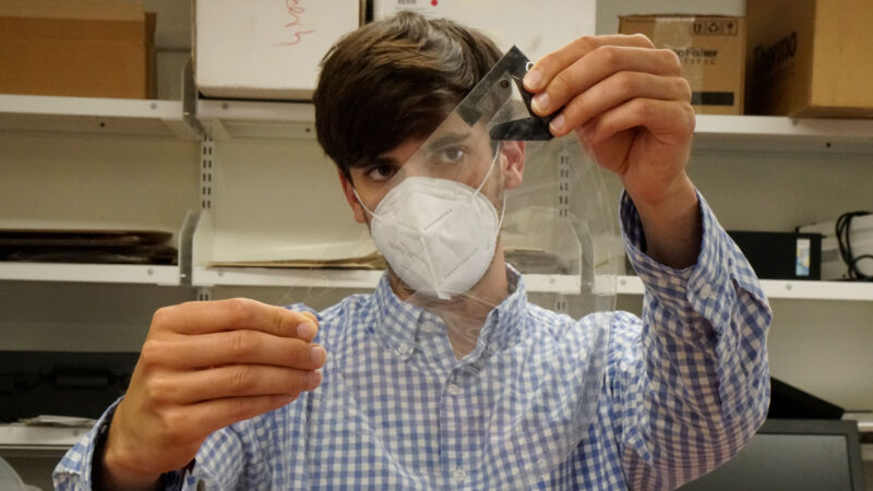 Researcher assembles a face shield