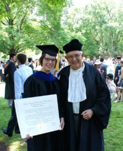 Graduate and professor in commencement robes