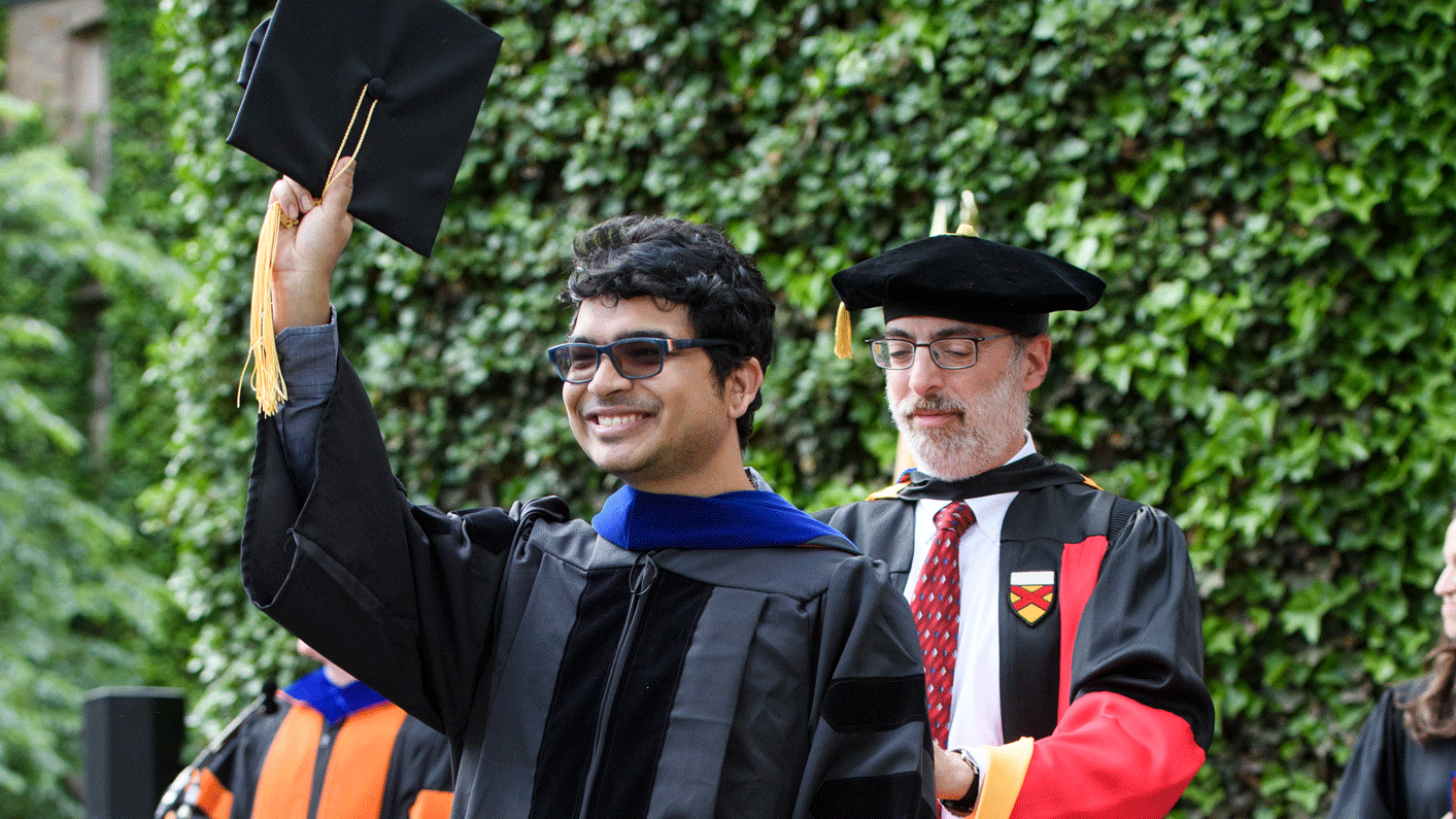 Hari Subedi *18 during his Ph.D. hooding ceremony with adviser Jeremy Kasdin.