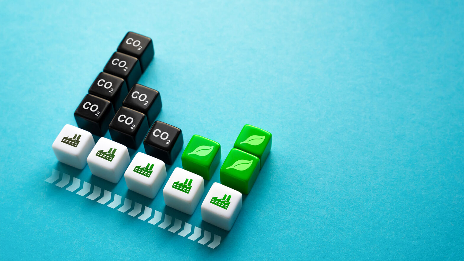 A set of dice showing the transition from a carbon-intensive to a sustainable energy system.