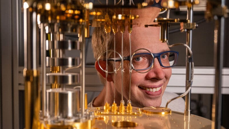 Portrait of researcher with quantum computer.