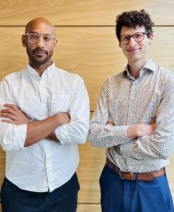 Datta and Browne pose with their arms folded.