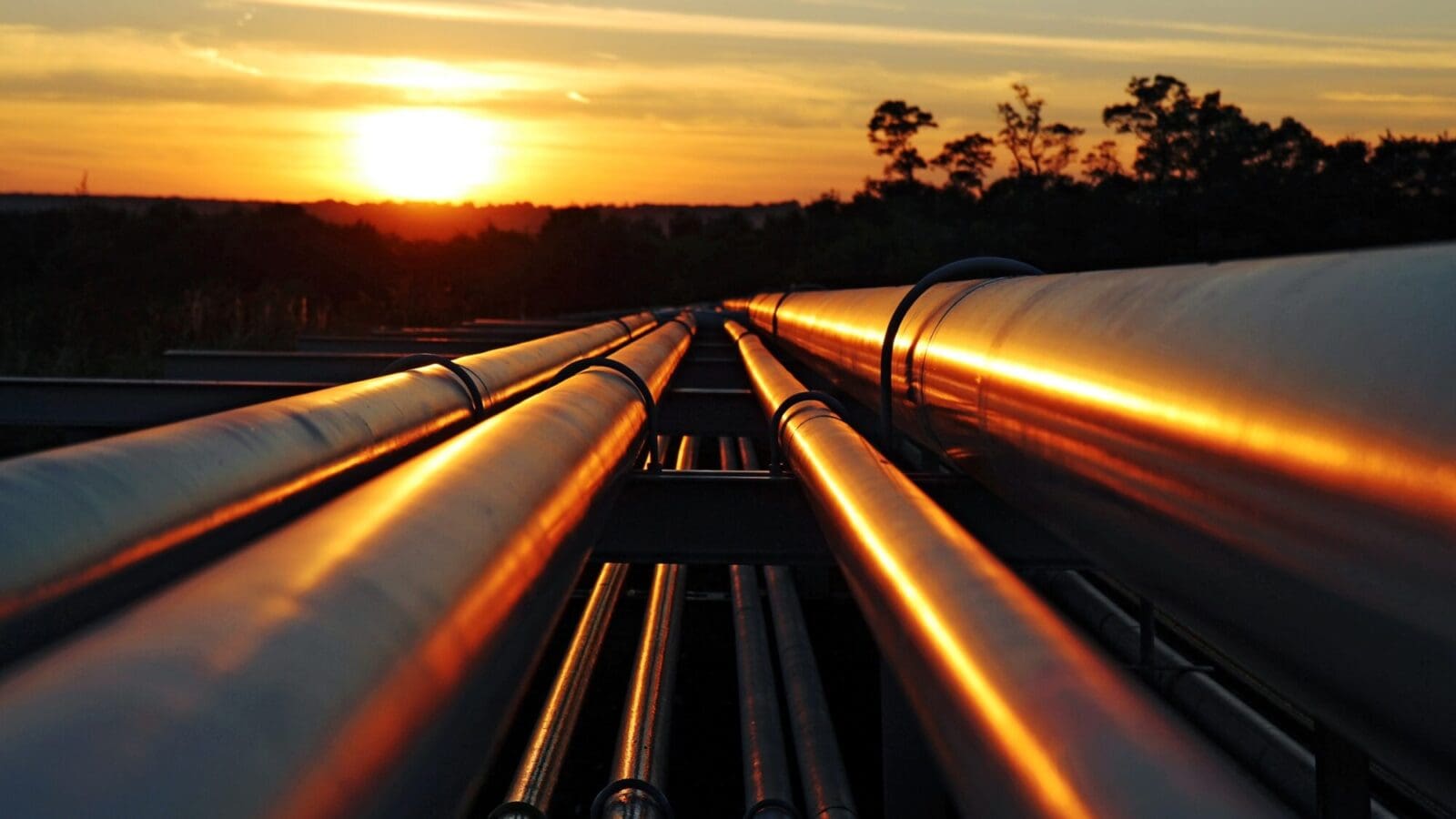 Pipelines against a sunset.