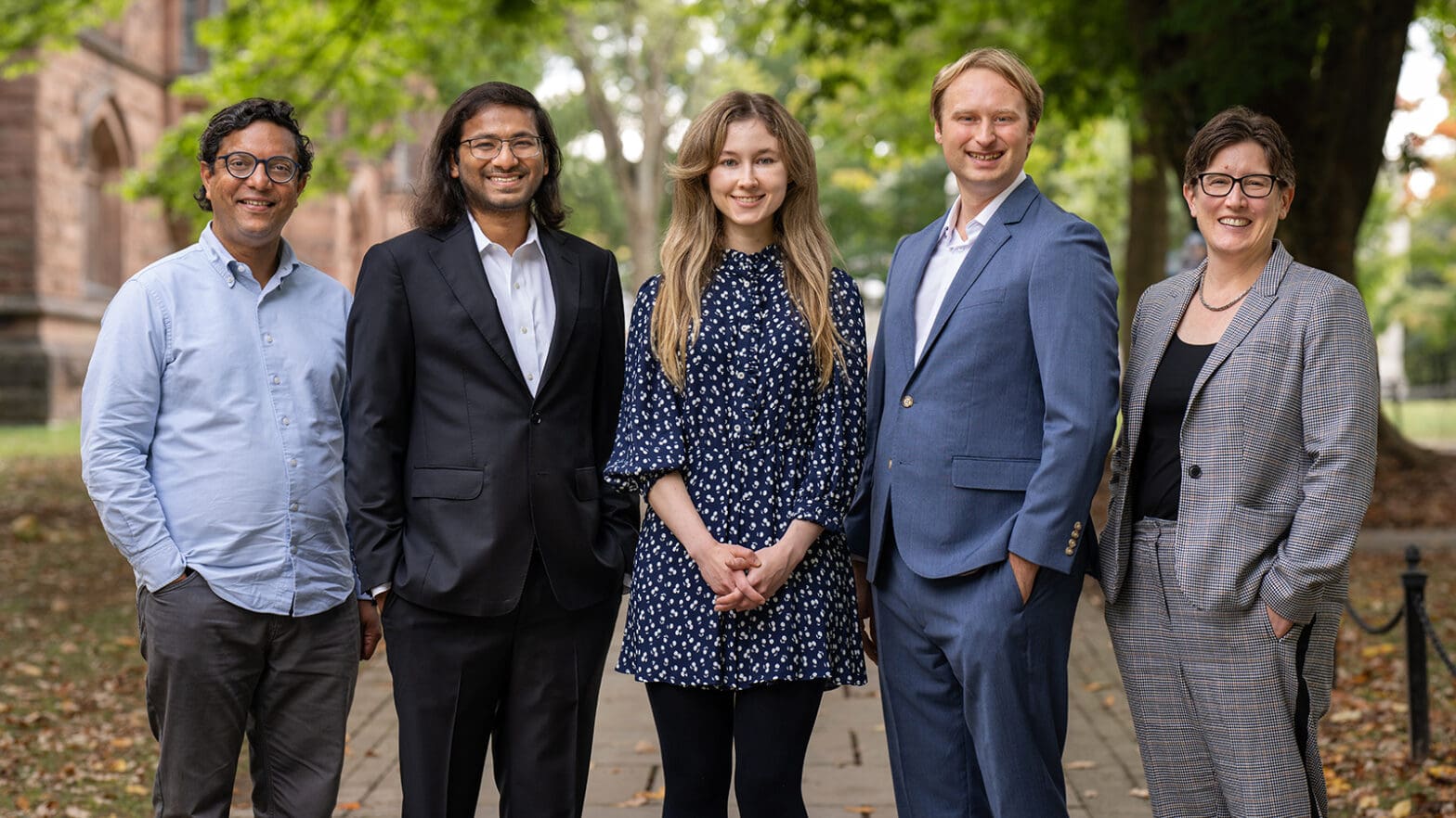 Group photo of the researchers on campus grounds.