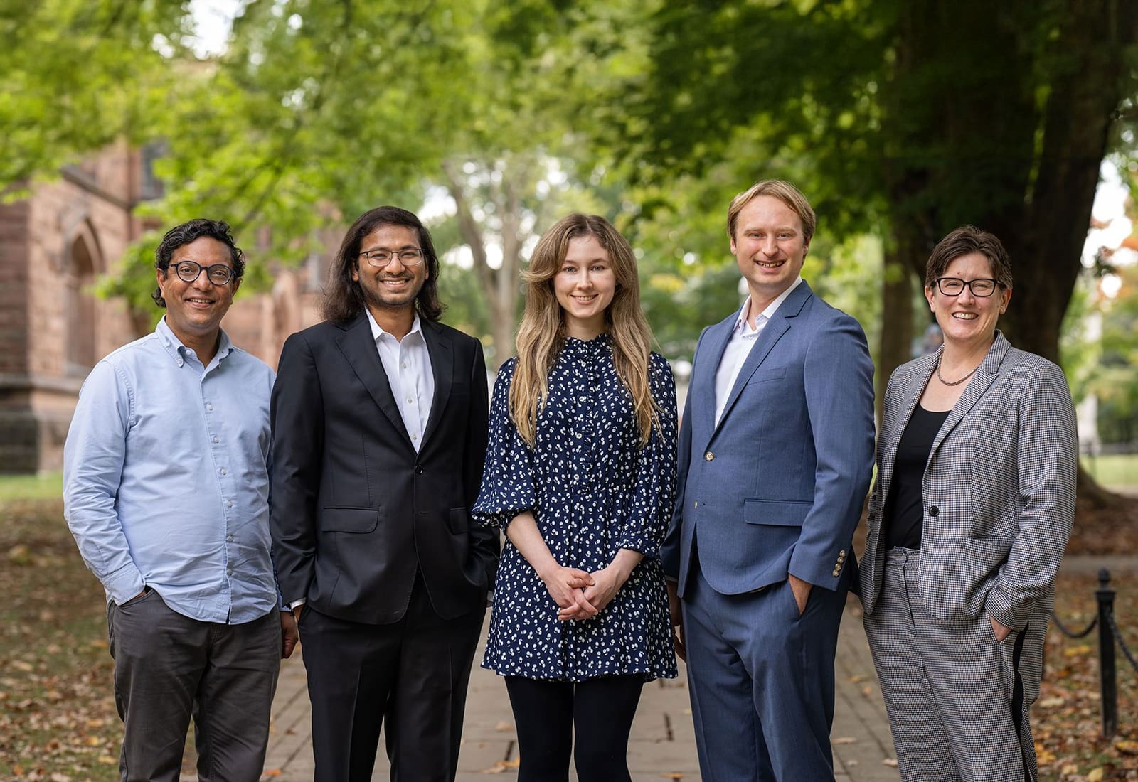 Group photo of the researchers on campus grounds.