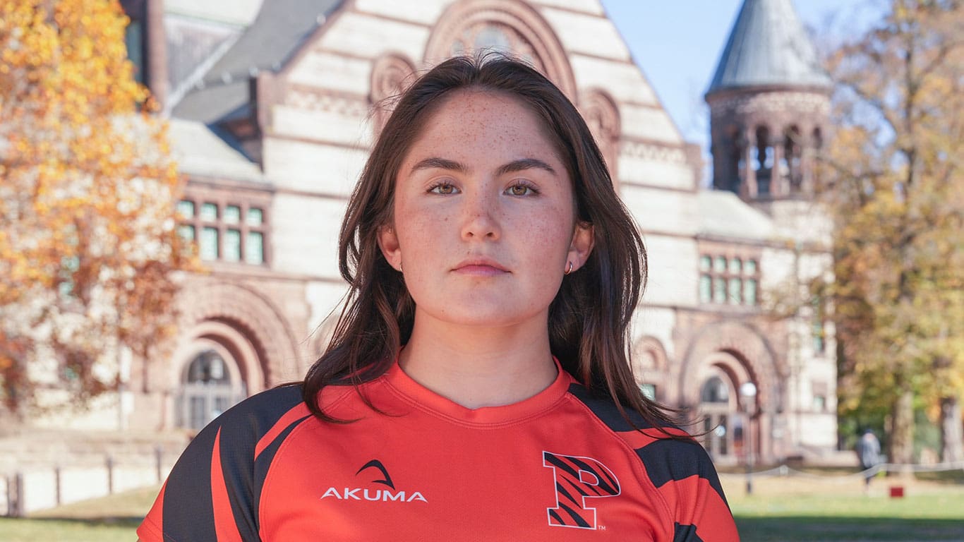 Portrait of Zoe Koniaris on the Princeton campus, wearing her rugby uniform.