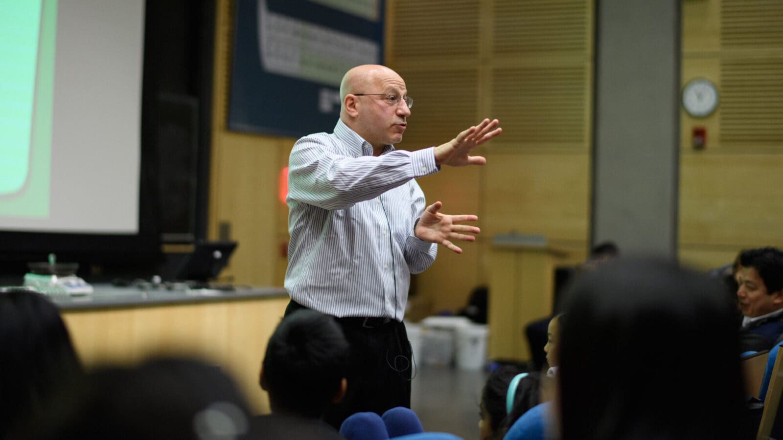 Howard Stone giving talk at front of lecture hall
