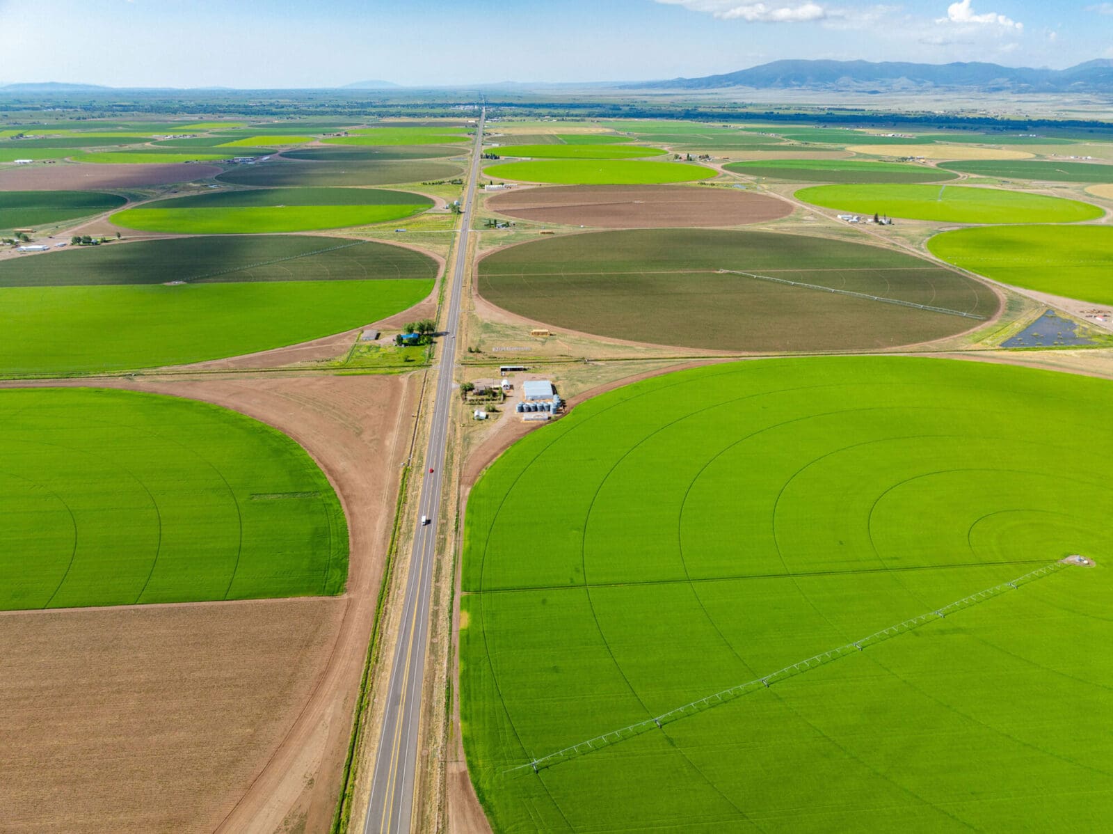 Aerial view of large circular crop fields.