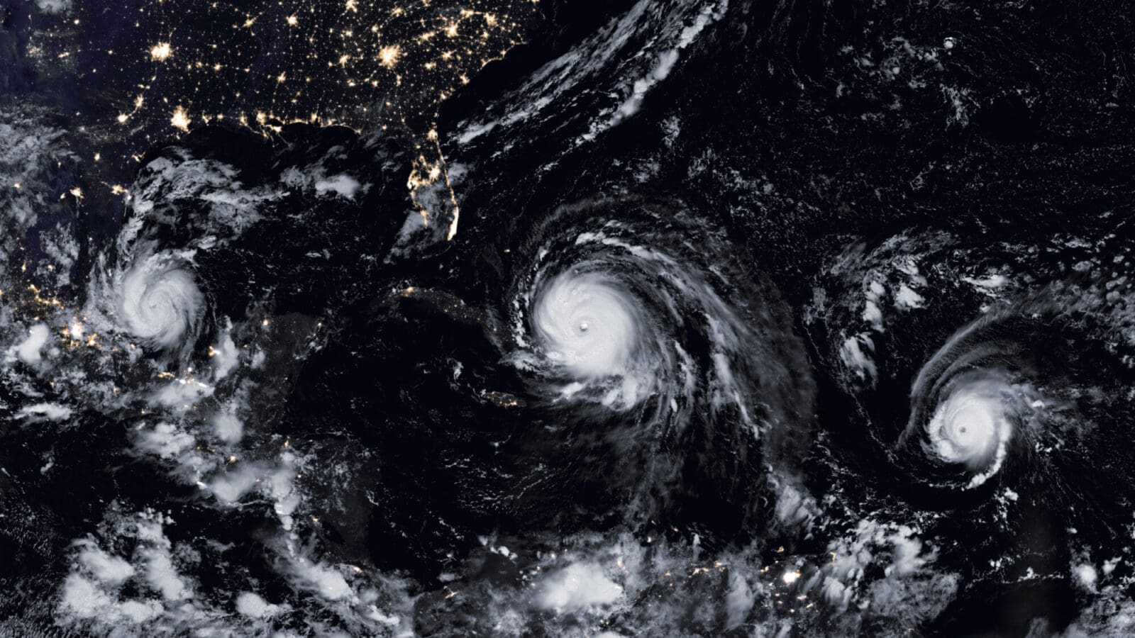 Aerial view of three tropical storms forming in the Atlantic basin.
