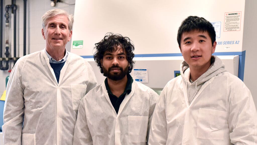 Three Princeton Engineering researchers in a biocomputing lab.