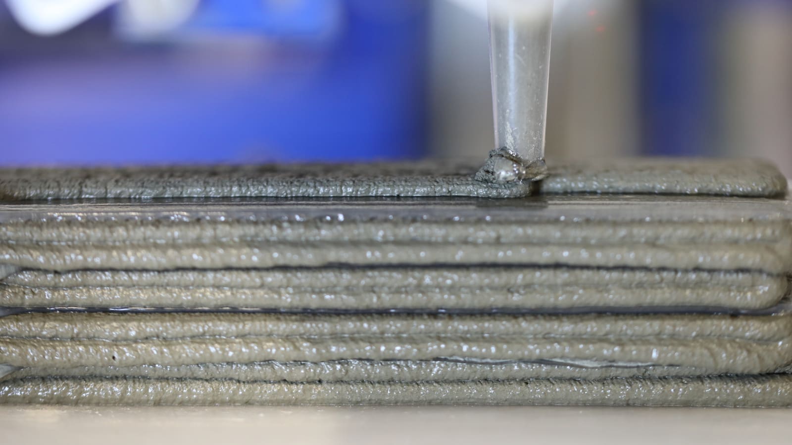 Stacked layers of concrete and thin polymer