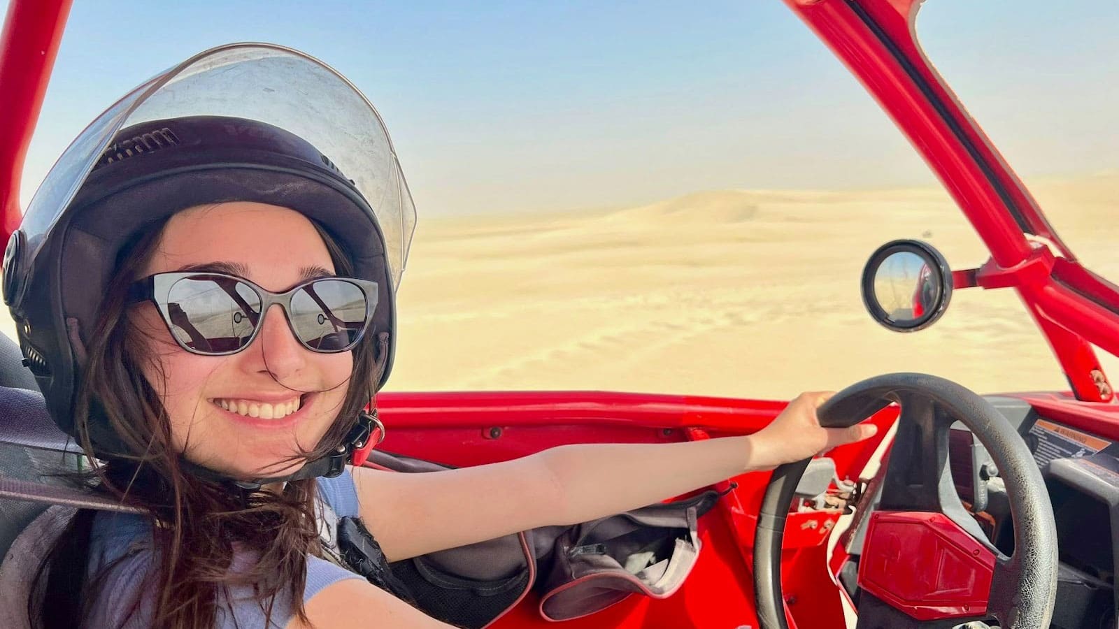 Zara Hommez driving a sand buggy.