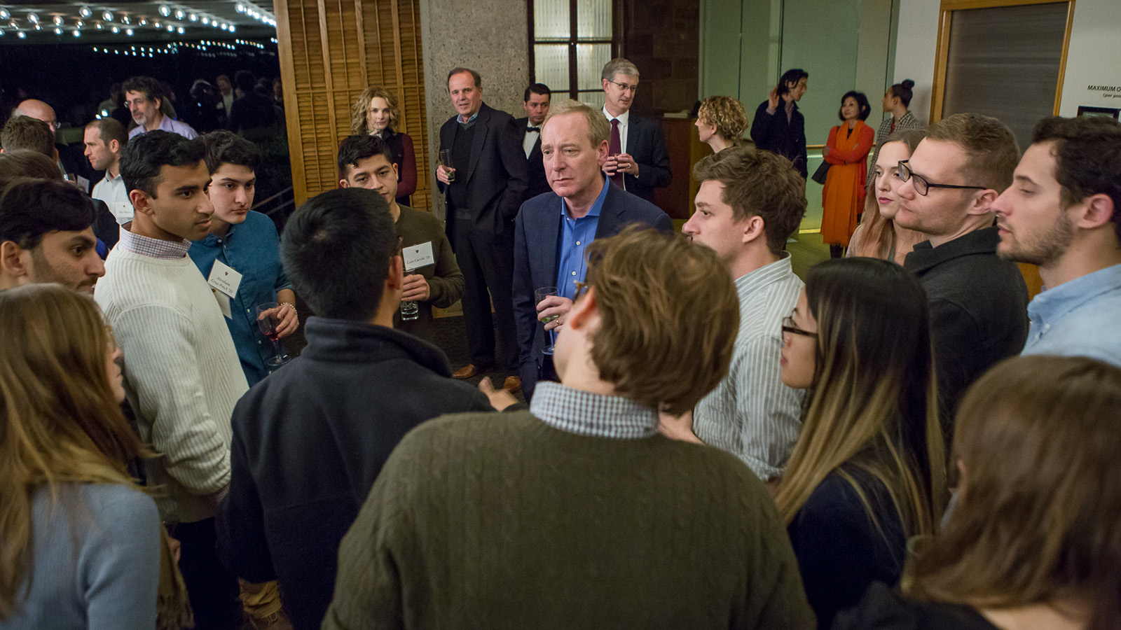 Microsoft President Brad Smith speaks with students at reception