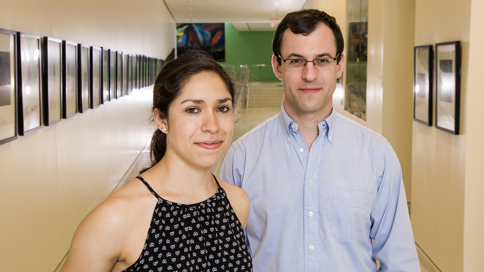 Researchers Marcela Melara and Michael Freedman stand in hallway