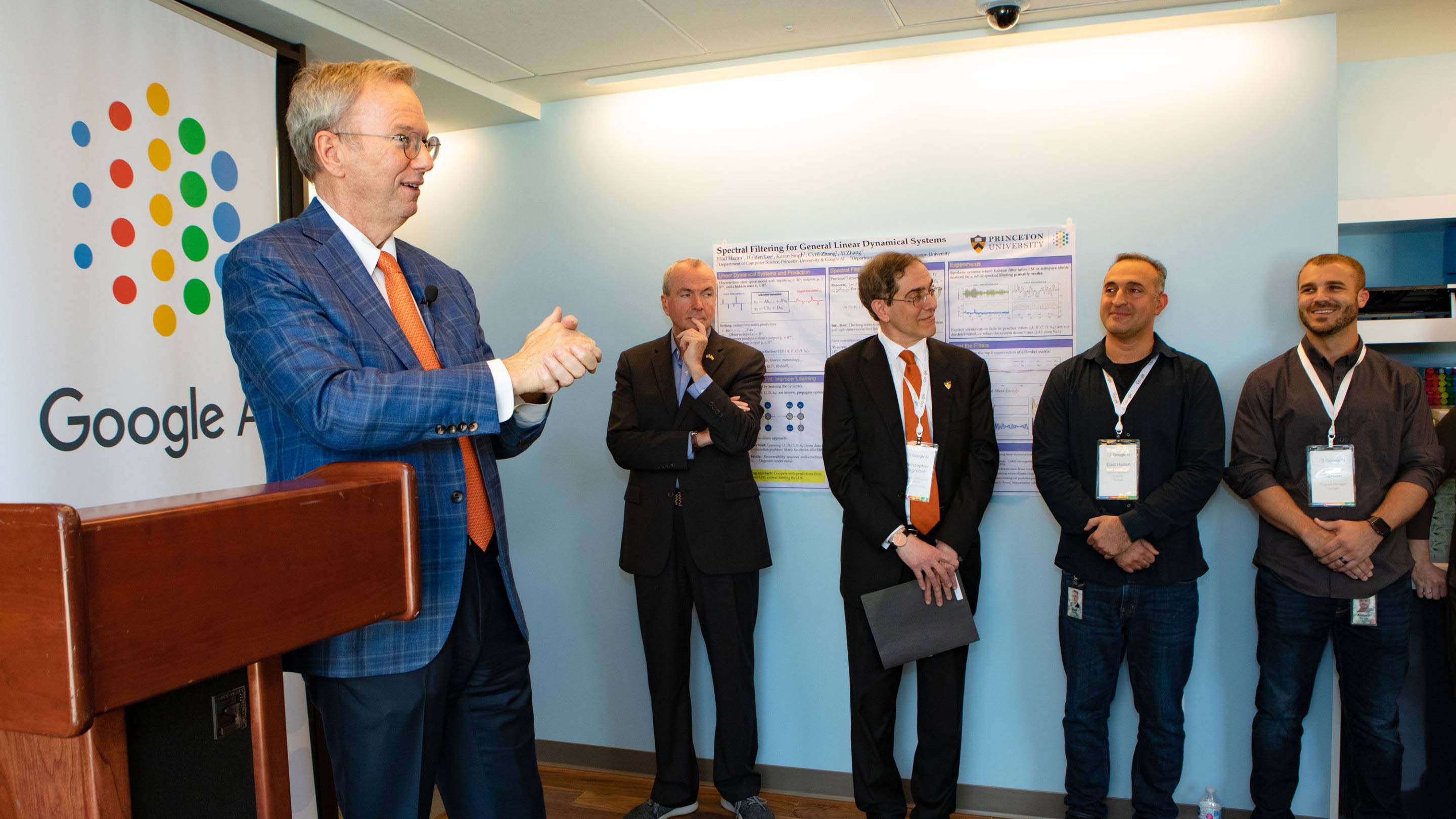 Eric Schmidt stands in front of lectern during ribbon cutting