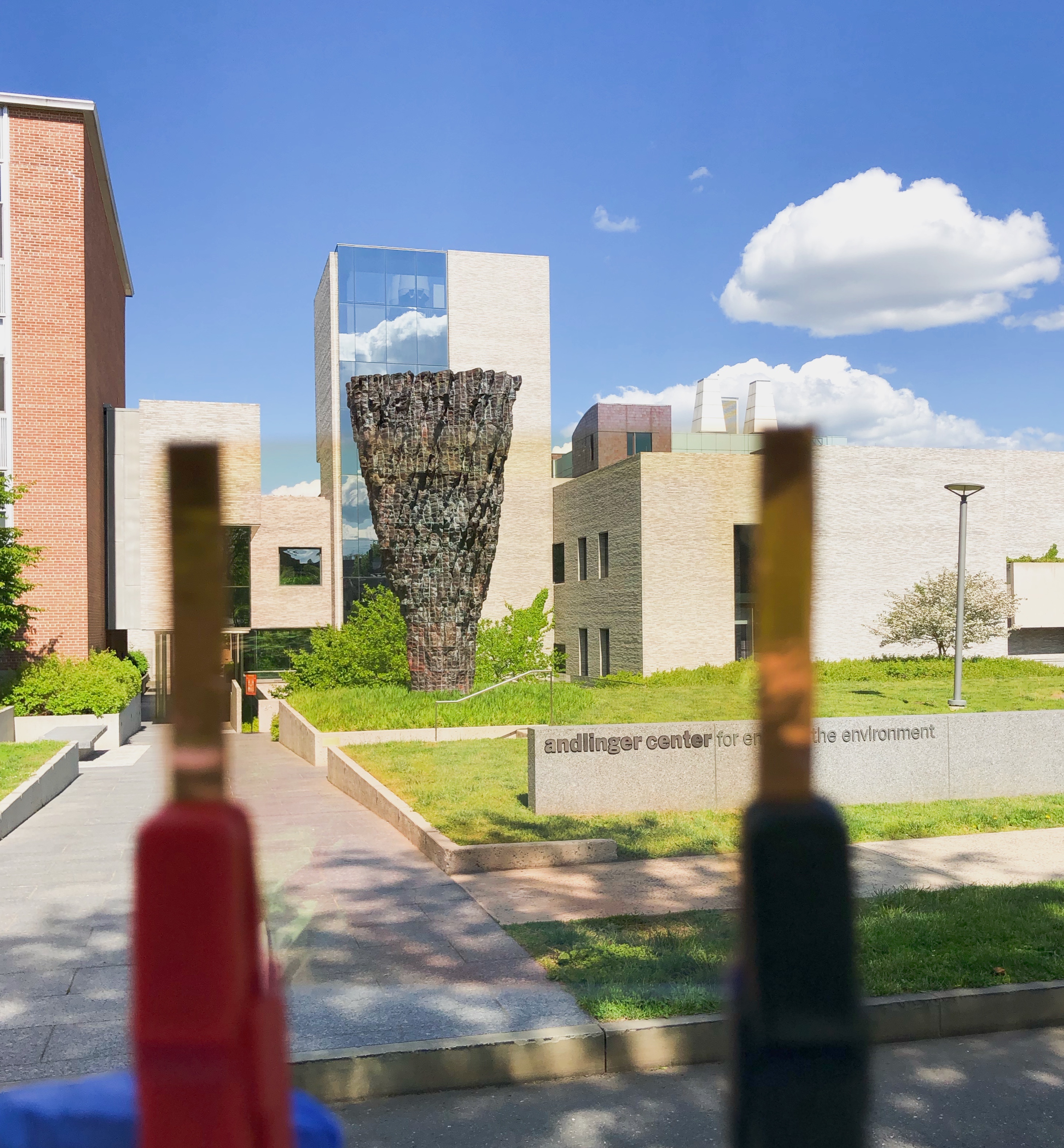 View of sculpture and building through transparent solar cell