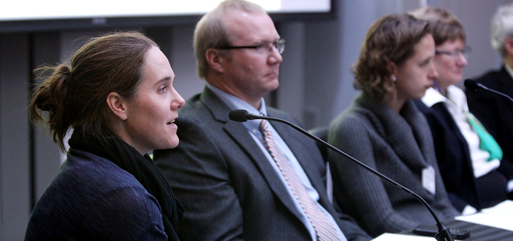 Claire White, seen here in profile, moderates panel discussion