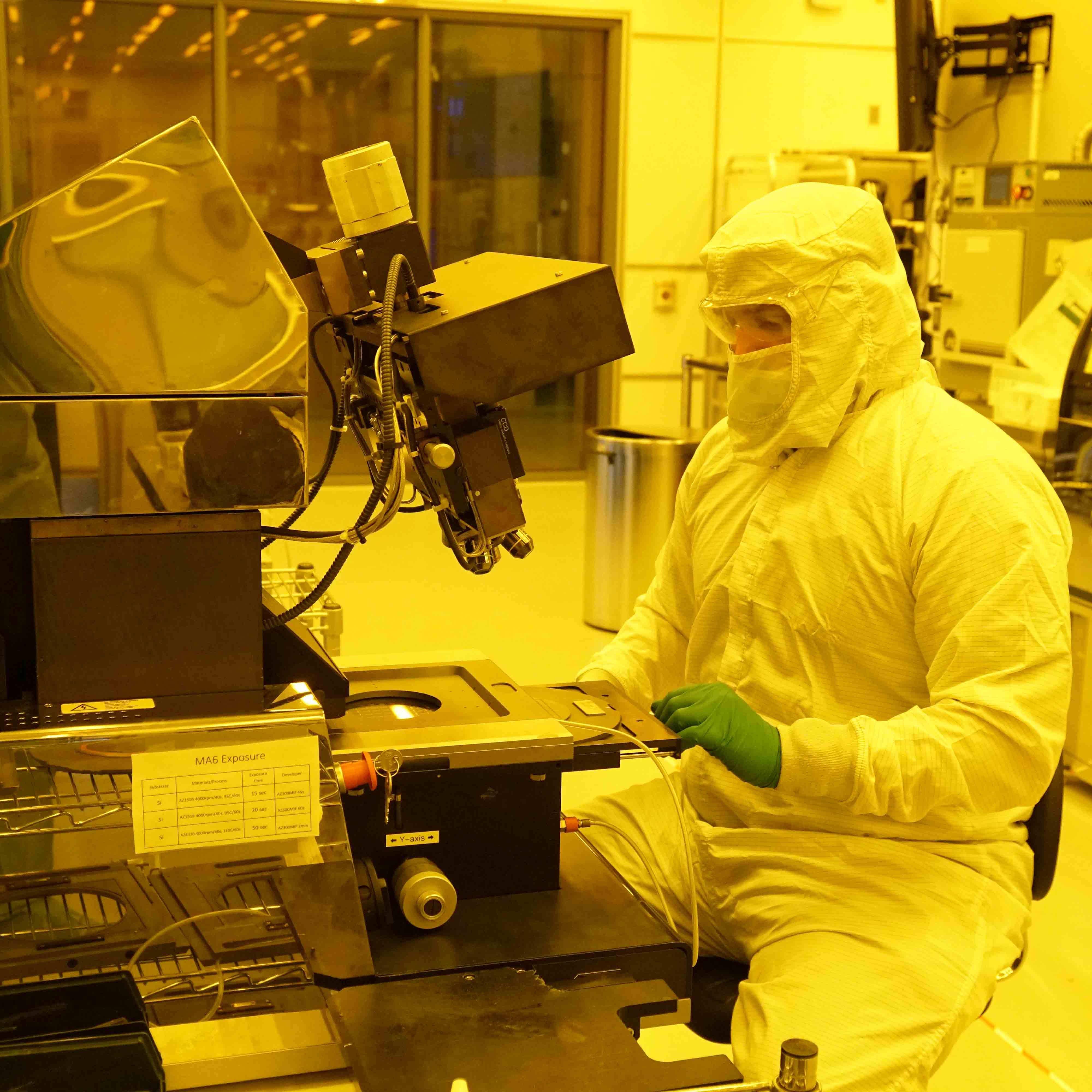 Eric Mills, in full protective gear, at work in the PRISM Cleanroom.