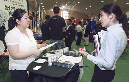 Student and recruiter at job fair