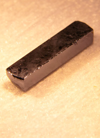 The highly purified sample of silicon-28 used in the experiment led by Lyon has a            very low magnetic signature at the atomic level, and therefore does not disrupt the spin of the electrons.            (Photo by John Jameson)