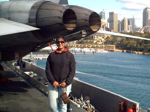 As part of the Scholars in the Nation's Service Initiative, Ishani Sud conducted            research on an American military base in Okinawa, Japan, during a summer internship prior to her senior year            at Princeton. She is seen on the deck of the USS Kitty Hawk off the coast of Australia.